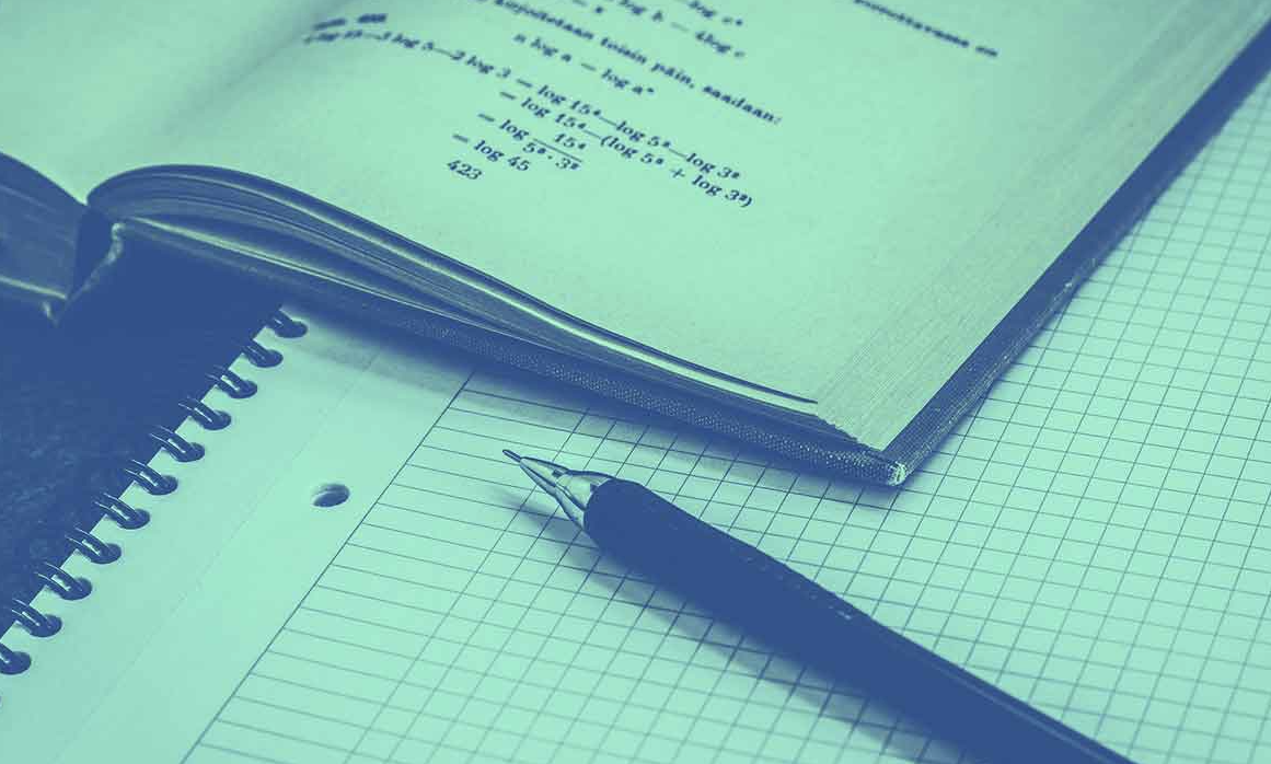 A book, pen and notepad