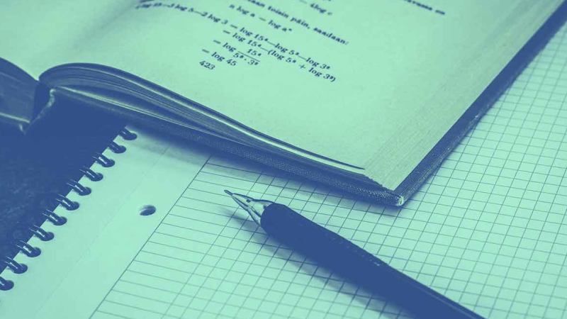 A book, pen and notepad